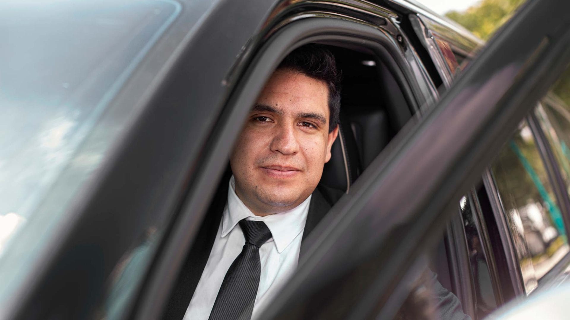 Private chauffeur Diego from Mexico City inside his vehicle