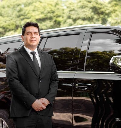 Private chauffeur Diego from Mexico City outside his vehicle