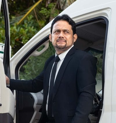 Private chauffeur Jose Carlos Antonio from Cancun outside his vehicle