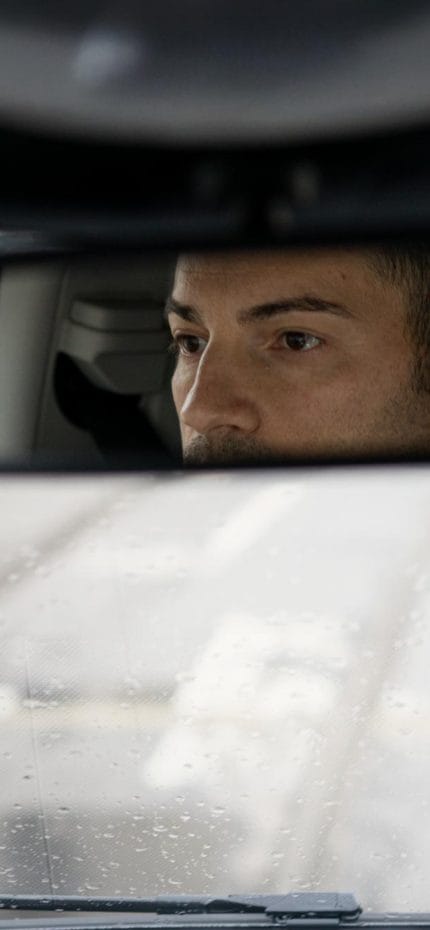 Private chauffeur Gianfranco from Milan inside his vehicle.