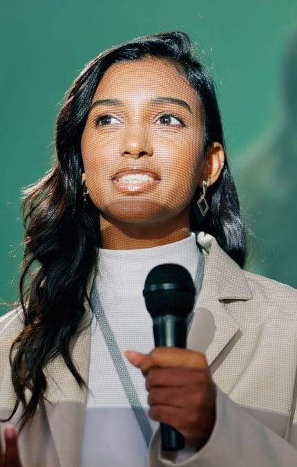 young businesswoman giving a speech during a technology congress