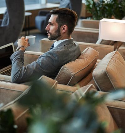 Business traveler waiting in a VIP airport lounge