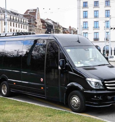 executive minibus parked in an urban environment.