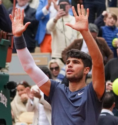 tennis player at roland garros, wearing a blue t-shirt